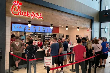 a long line outside a Chick-fil-A a long line outside a Chick-fil-A